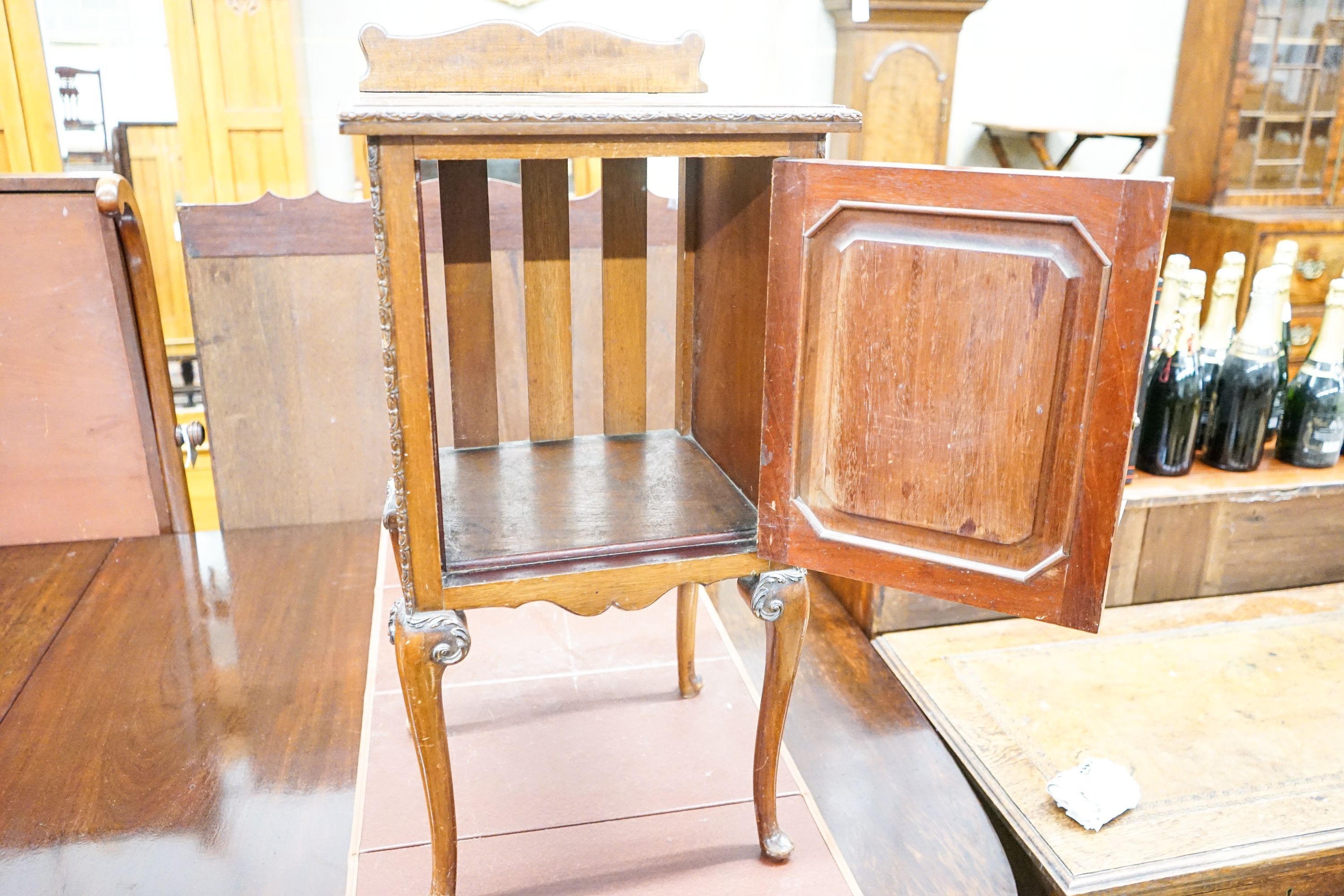 A Queen Anne style carved and figured mahogany bedside cabinet, width 40cm, depth 38cm, height 84cm